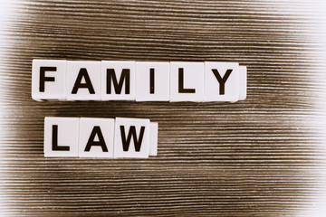 Blocks with letters regarding child-custody and family-law concept. Retro stylization