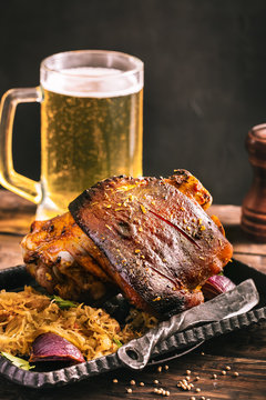 Rustic eisbein with braised cabbage and beer