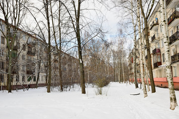 Fototapeta na wymiar Snowy yard square in St. Petersburg