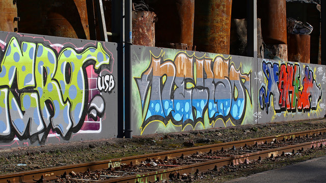 Cadenazzo, Switzerland, February 2016, Urban wall texture along railroad tracks keep popping up along railway tracks - graffiti art abstract background