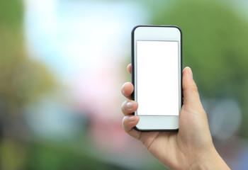woman hands with smart phone in modern city