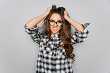 Portrait of cute teen girl wearing stylish shirt isolated on gray background fashion for teenagers