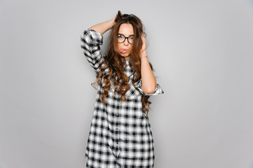 Portrait of cute teen girl wearing stylish shirt isolated on gray background fashion for teenagers