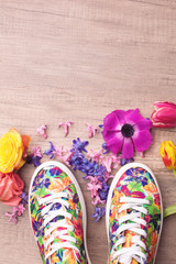 Sneakers and flowers around