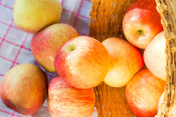 Fresh and colorful apples in basket, selective focus