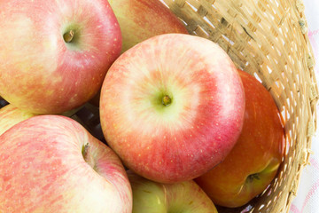 Fresh and colorful apples in basket, selective focus