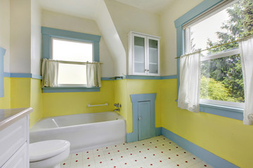 Cute bathroom with yellow walls