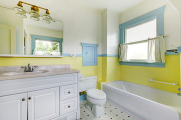 Cute bathroom with yellow walls