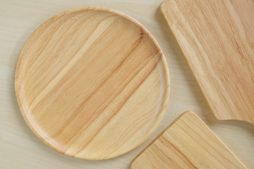 Empty wooden plates on table, food background