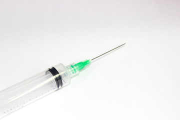injection tool that has a sharp tip and a white background, commonly used midwife or doctor