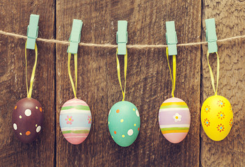 Line of eggs wooden wall. Happy easter