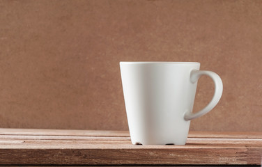 Gray cup on wooden table