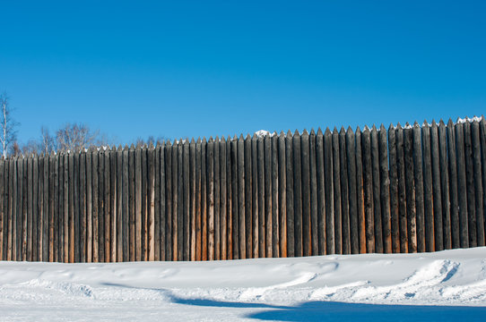 high wooden fence