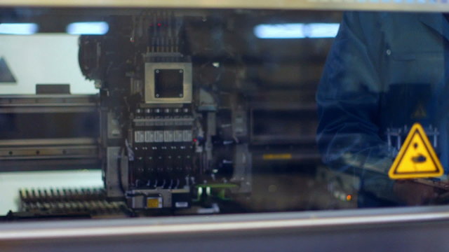 Detail view of Automated machine at work in factory