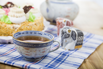 Cake with cream and tea