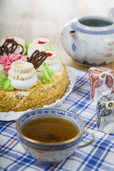 Cake with cream and tea