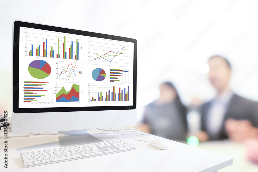 Poster Modern computer with keyboard and mouse on table showing charts