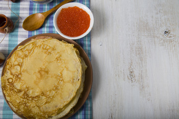 Pancakes with caviar on the table