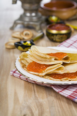 Pancakes with caviar on the table