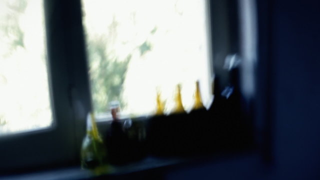 Point-of-view of a drunk person. Everything in a room is defocused and trembling.
