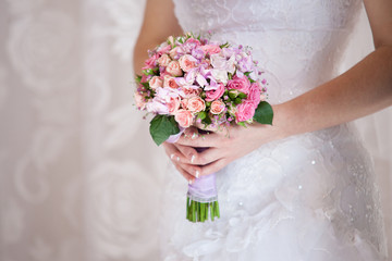Bride holding the bouquet of flowers