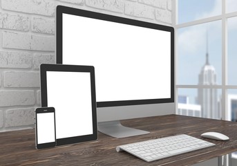 Responsive mockup screen. Monitor, tablet, phone on table in office.