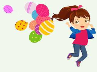 Girl holding balloons