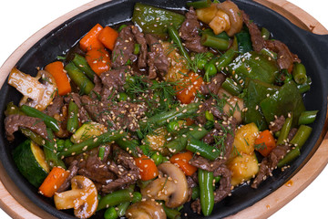 Stewed veal with mushrooms and vegetables, closeup