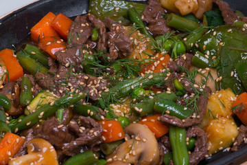 Veal with asparagus and vegetables, closeup