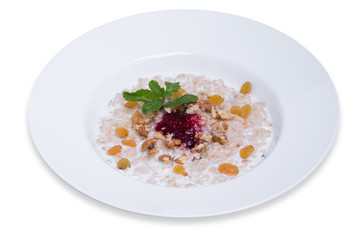 Oatmeal with raisins and walnuts, isolated with clipping path