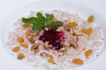 Healthy oatmeal with raisins and walnut