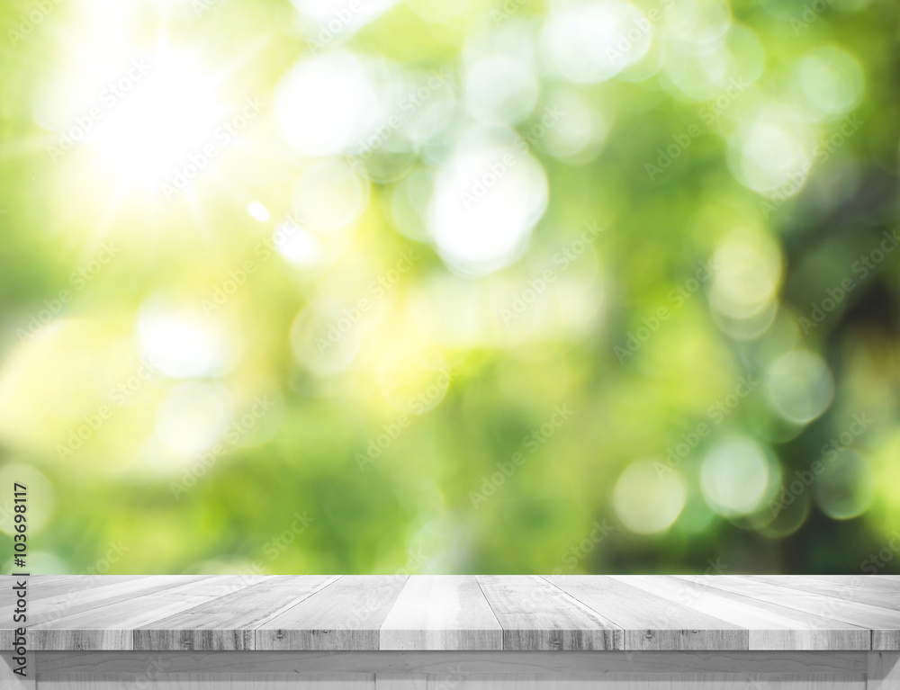 Poster empty plank white wood table top with blur green tree bokeh back