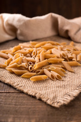 Bowl of penne noodles in rustic style