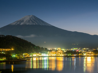 Fuji mountain under cloudy sky with lake