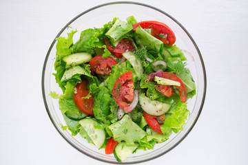 Vegetable salad of tomatoes, cucumbers and lettuce