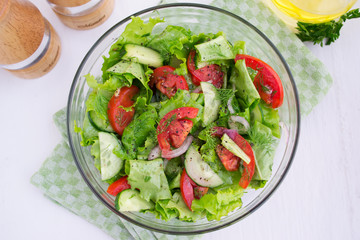 Vegetable salad of tomatoes, cucumbers and lettuce