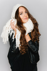 Portrait of cute teen girl isolated on gray studio background posing to the camera
