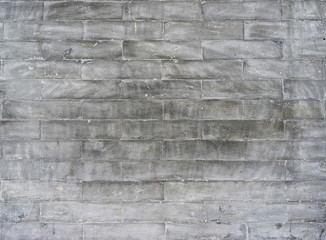 Wallpaper: old grey dirty bricks.