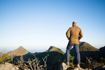 Mountain top with southeast asian man