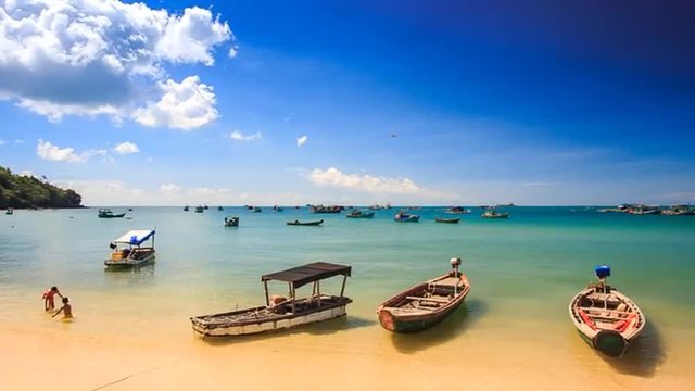 Camera Moves to Vietnamese Tourist Boats at Beach up to Horizon