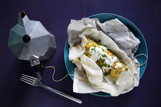 Tamales of masa harina, corn flour, with chicken and sour cream