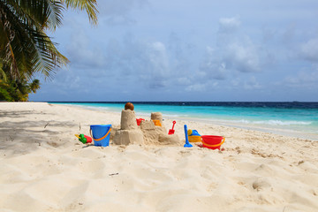 Sand castle on tropical beach