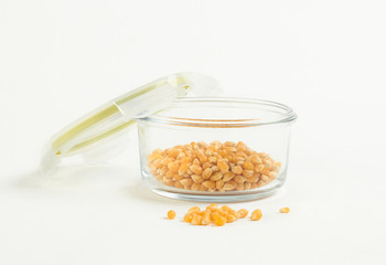 yellow corn seed for popcorn in a glass bowl