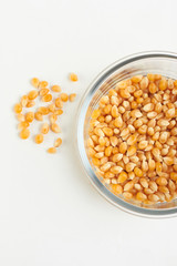 yellow corn seed for popcorn in a glass bowl