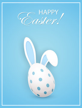 Rabbit ears and Easter egg on blue background