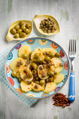 potatoes salad with green olives capers and hot chili pepper