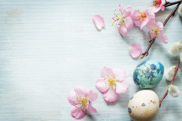 Obraz na płótnie Canvas Easter eggs and cherry blossom retro blue background 