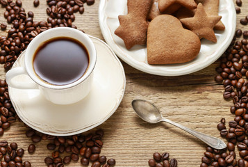 Cup of coffee and plate of gingerbread cookies