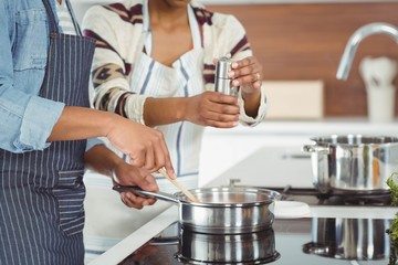 Midsection of couple cooking together