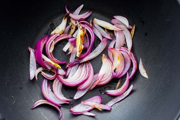 Red onion fried in pan, home cooking